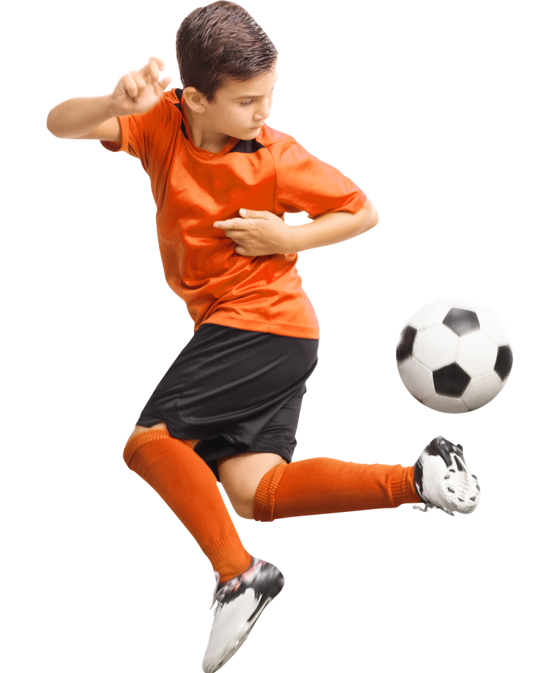 Young boy playing football
